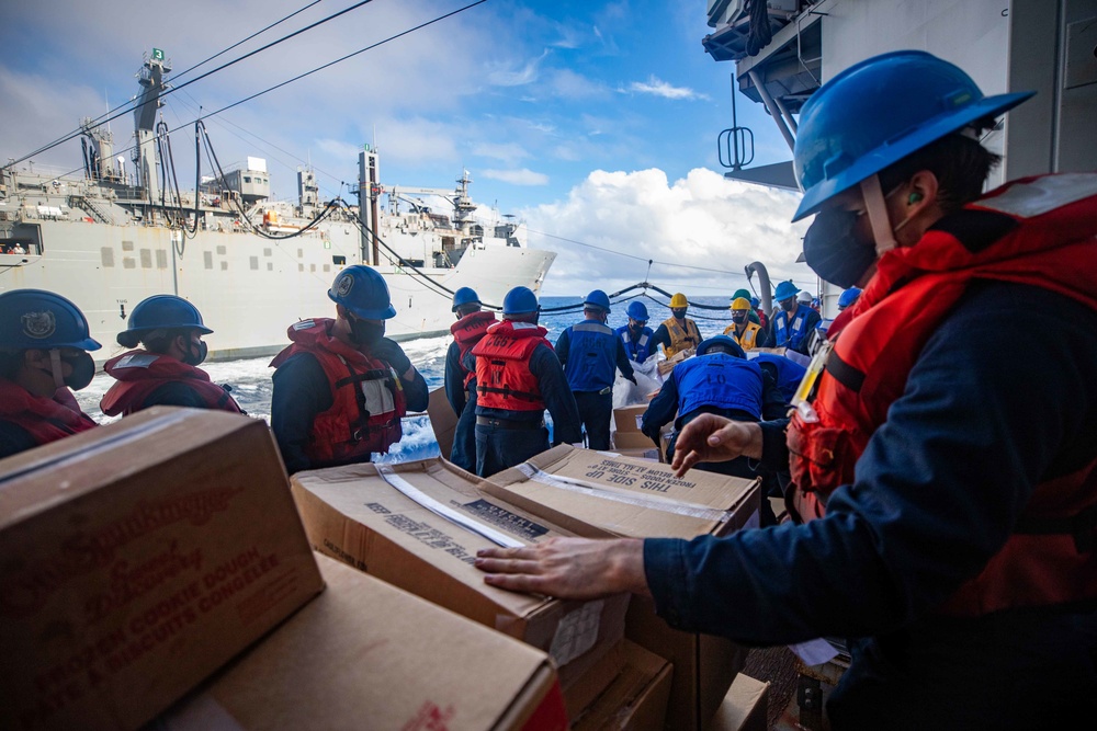 Sailors Transfer Boxes of food During RAS