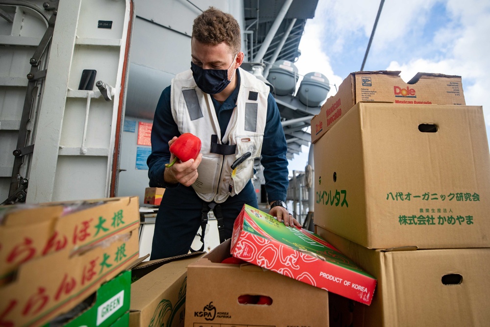 Sailor Inspects vegetables During RAS