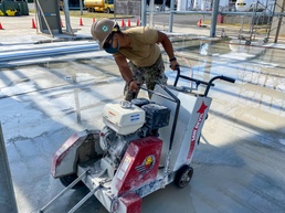 U.S. Navy Seabees continue construction of warehouse and maintenance buildings in support of NBU 7.