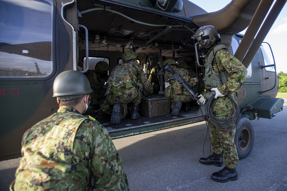 U.S. Marines and JGSDF conduct a simulated MEDEVAC on Camp Courtney