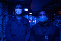 Sterett Brothers Stand Watch in Combat Information Center