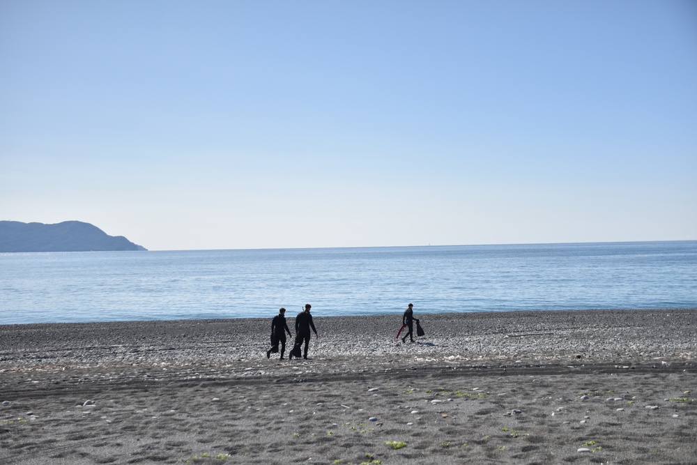 Scout swimmers survey Numazu Beach