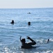 Scout swimmers survey Numazu Beach