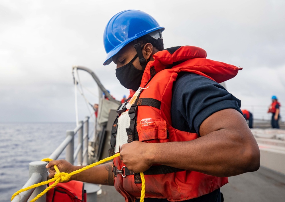 Sailor Secures Safety Line