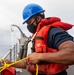 Sailor Secures Safety Line