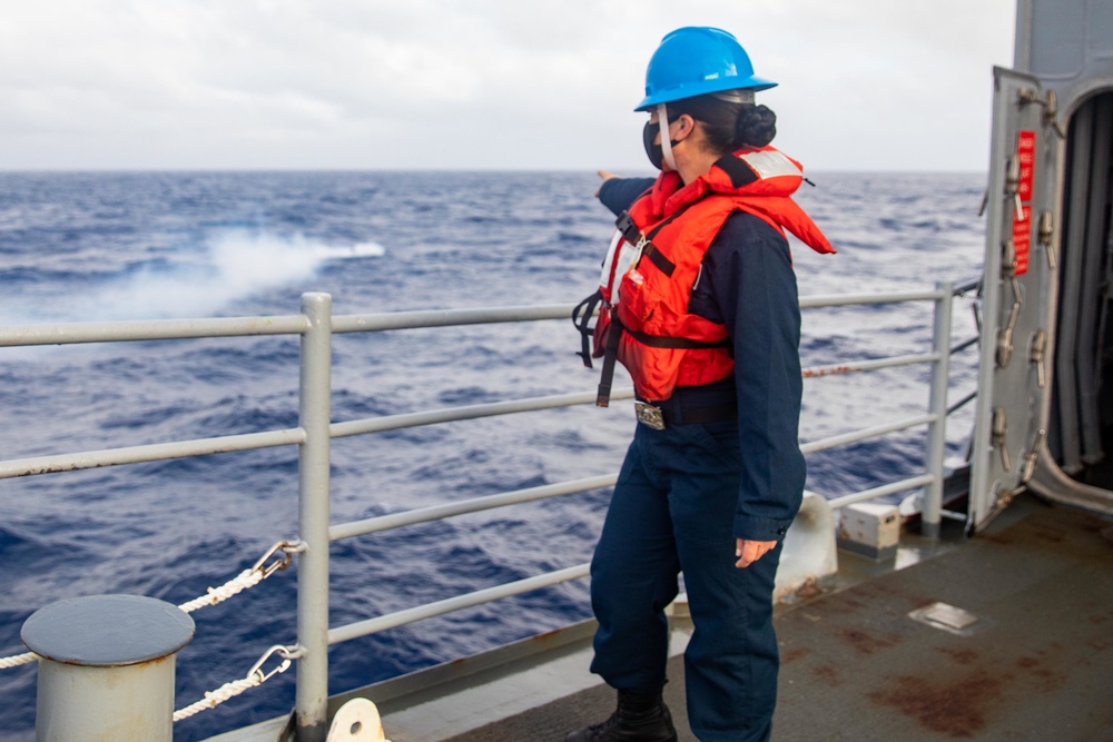 Sailor Points to Simulated Man Overboard