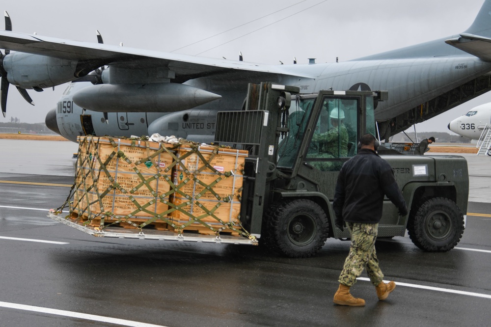 Sailors Load Cargo onto C-130