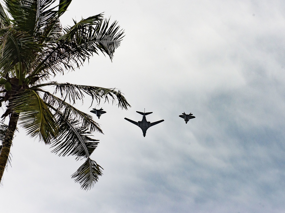 B-1 Lancer, F-22 Raptors Conduct Guam Veterans Day Flyover