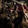 Sweden and U.S. Strengthen Air Capabilities During Swedish-led Bilateral Exercise Military personnel in full combat gear are seated inside what appears to be a large military transport aircraft, positioned in or around a light tactical vehicle. At least three soldiers wearing MultiCam camouflage uniforms, helmets with night-vision mounts, tactical vests, and sunglasses are visible. The interior of the aircraft shows red cargo straps, tan structural tubing, and safety markings consistent with a heavy-lift helicopter such as a CH-47 Chinook.