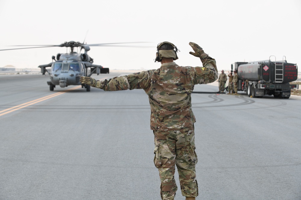 AUAB Airmen conduct hot-pit refueling on Navy MH-60 Seahawk helicopter