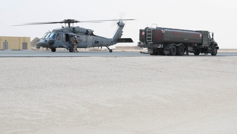 AUAB Airmen conduct hot-pit refueling on Navy MH-60S Seahawk helicopter