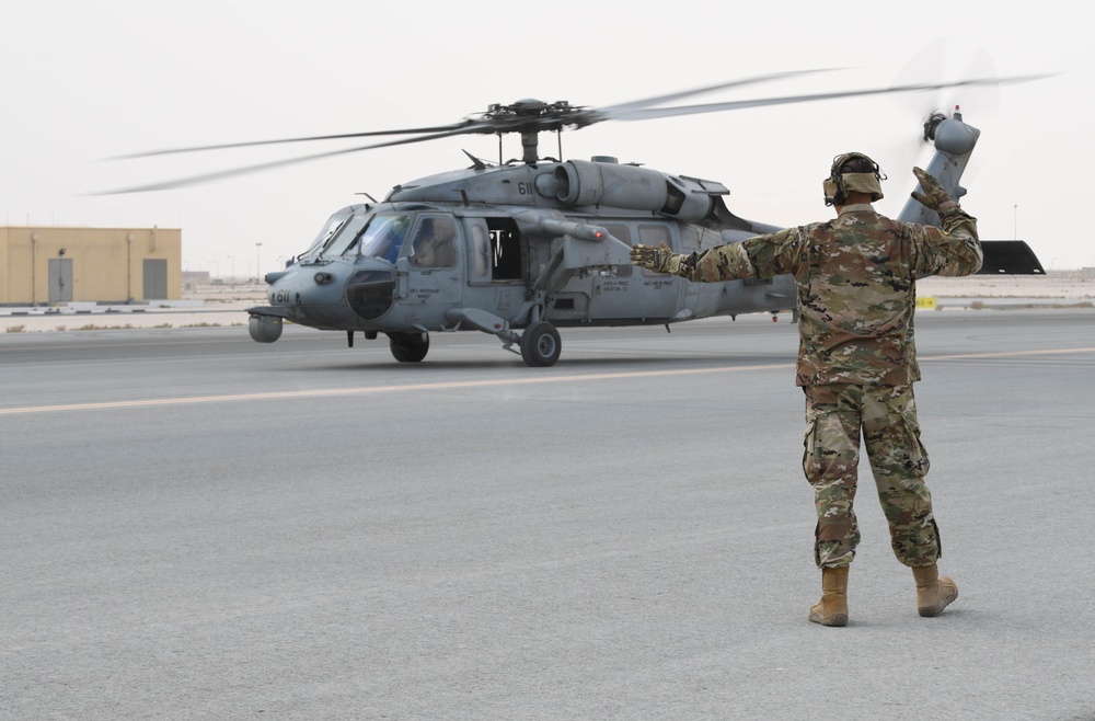 AUAB Airmen conduct hot-pit refueling on Navy MH-60S Seahawk helicopter