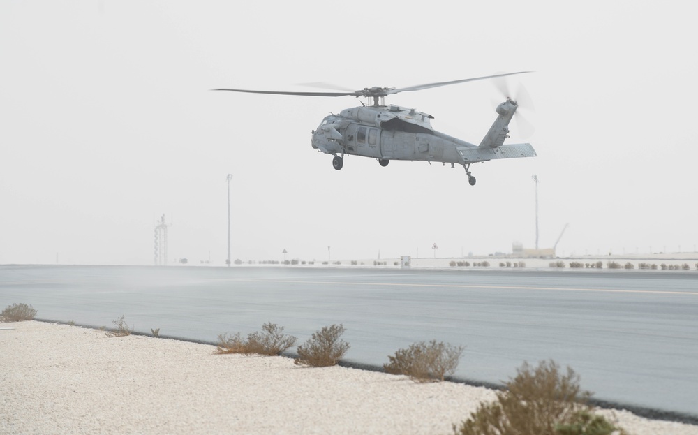 AUAB Airmen conduct hot-pit refueling on Navy MH-60S Seahawk helicopter