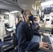 USS Ralph Johnson Sailors Check Engineering Log