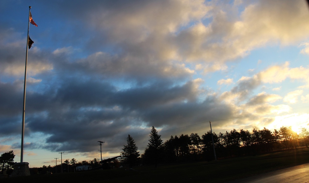 American flag, sunrise, and Veterans Day at Fort McCoy