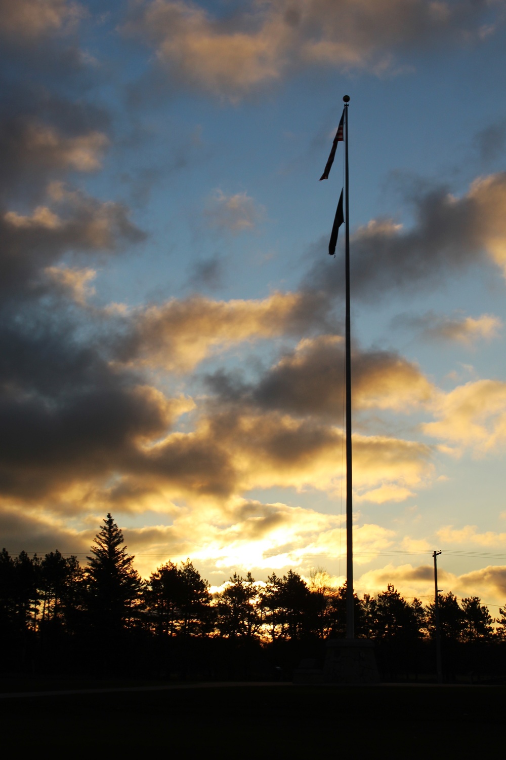 American flag, sunrise, and Veterans Day at Fort McCoy