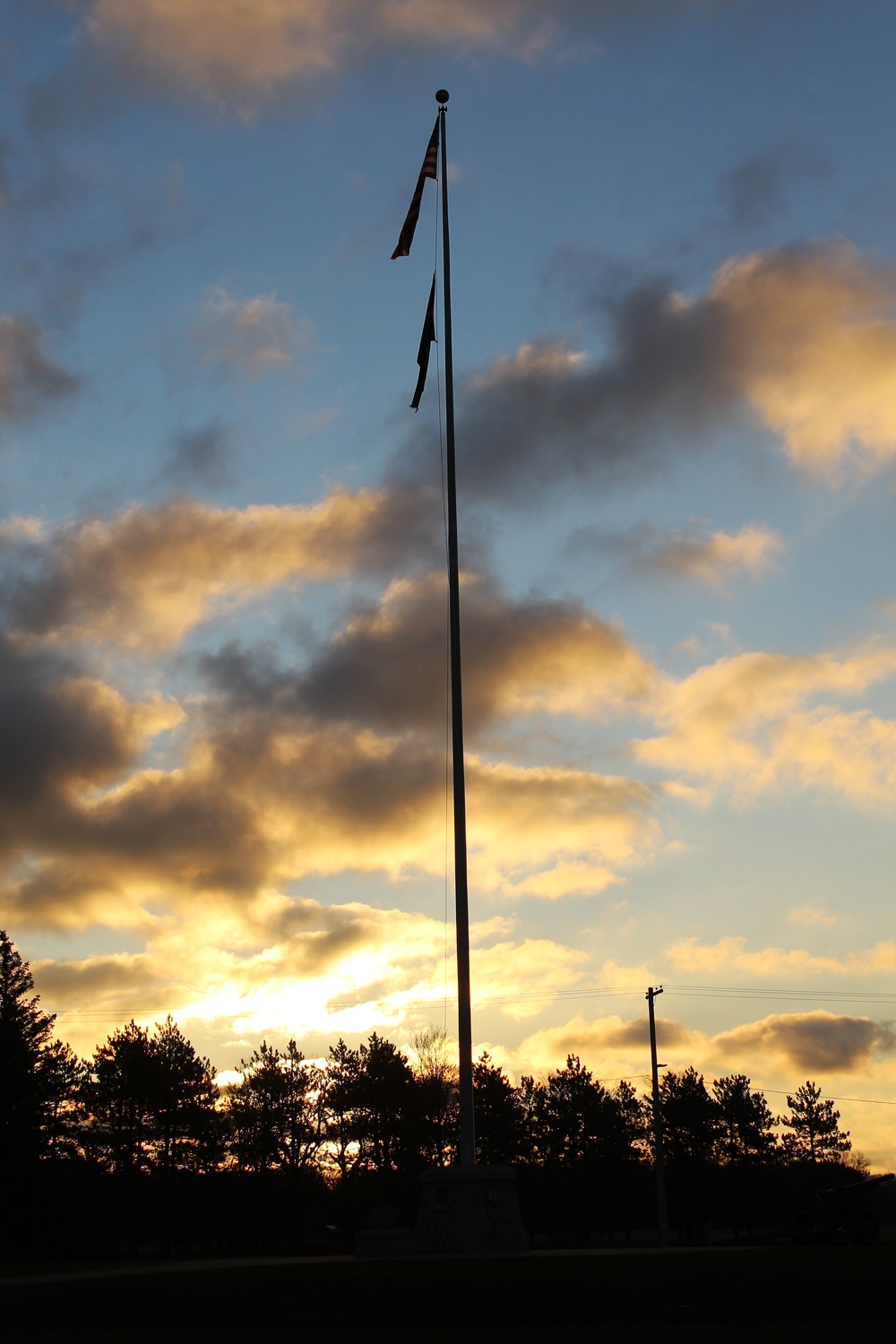 American flag, sunrise, and Veterans Day at Fort McCoy