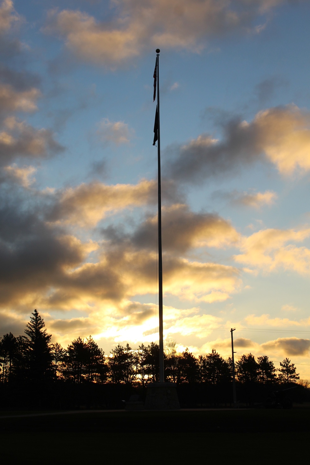 American flag, sunrise, and Veterans Day at Fort McCoy