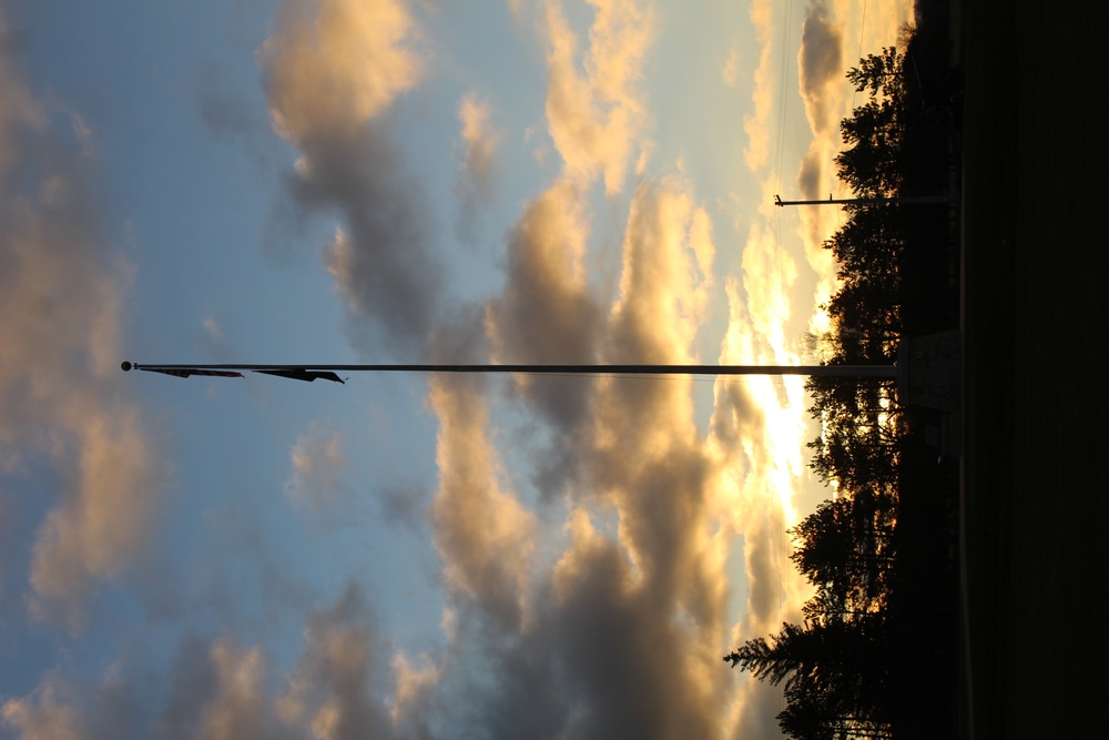 American flag, sunrise, and Veterans Day at Fort McCoy