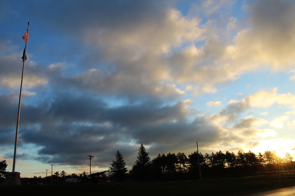 American flag, sunrise, and Veterans Day at Fort McCoy