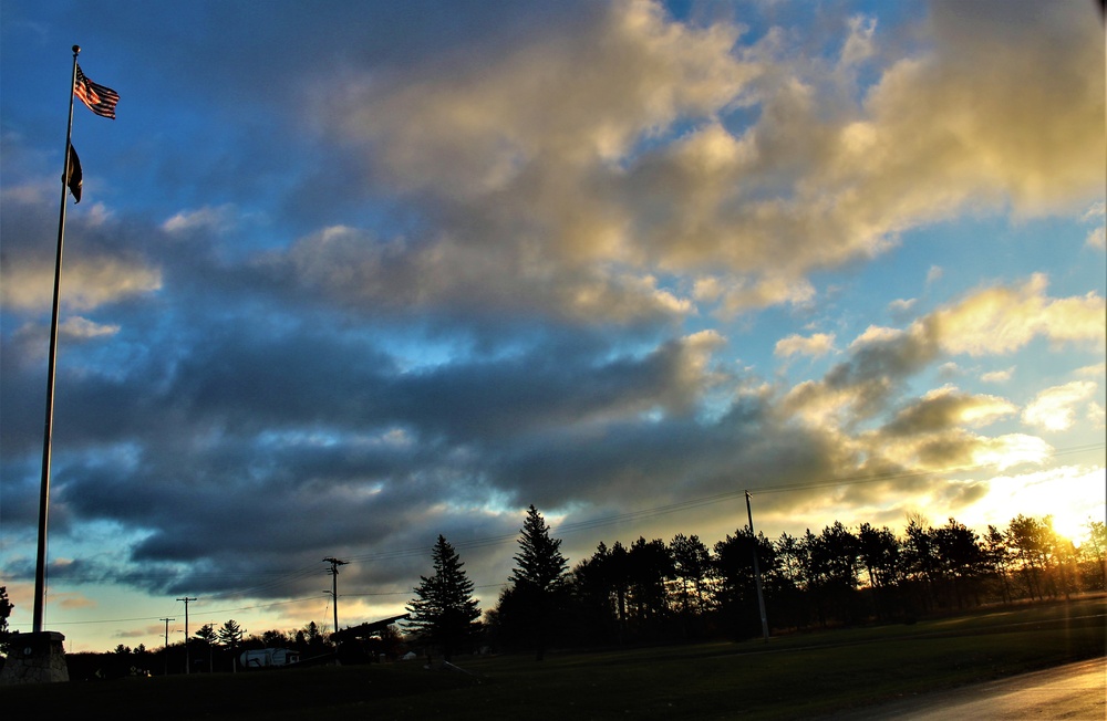 American flag, sunrise, and Veterans Day at Fort McCoy