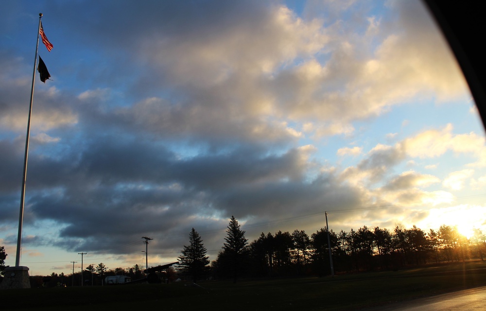 American flag, sunrise, and Veterans Day at Fort McCoy