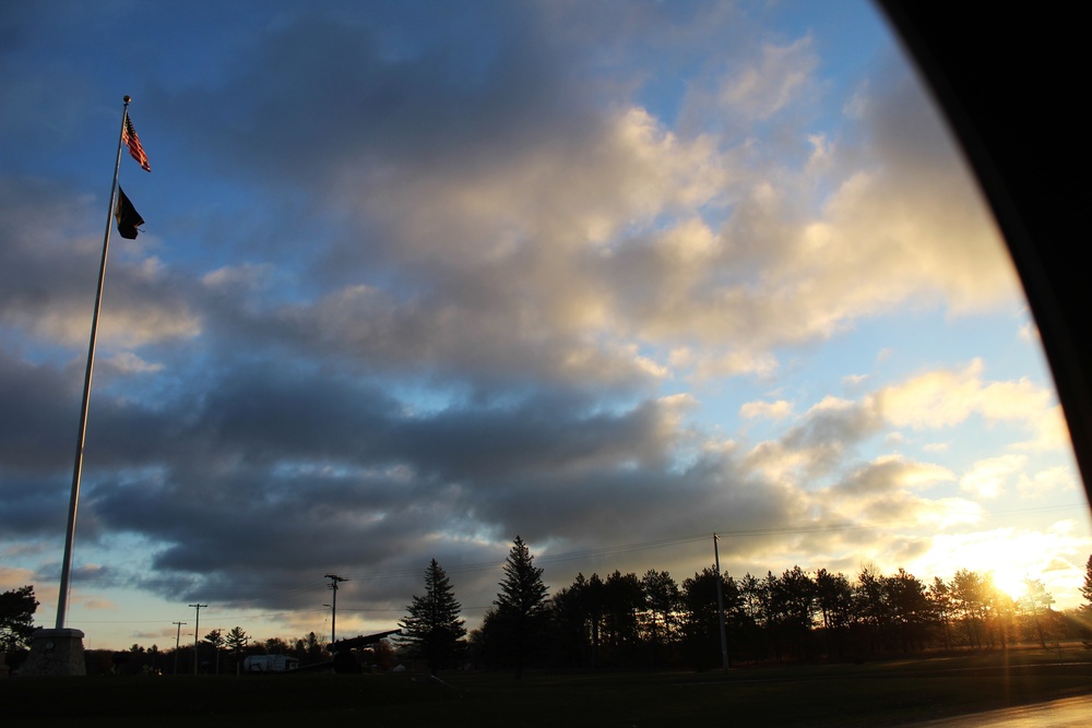 American flag, sunrise, and Veterans Day at Fort McCoy