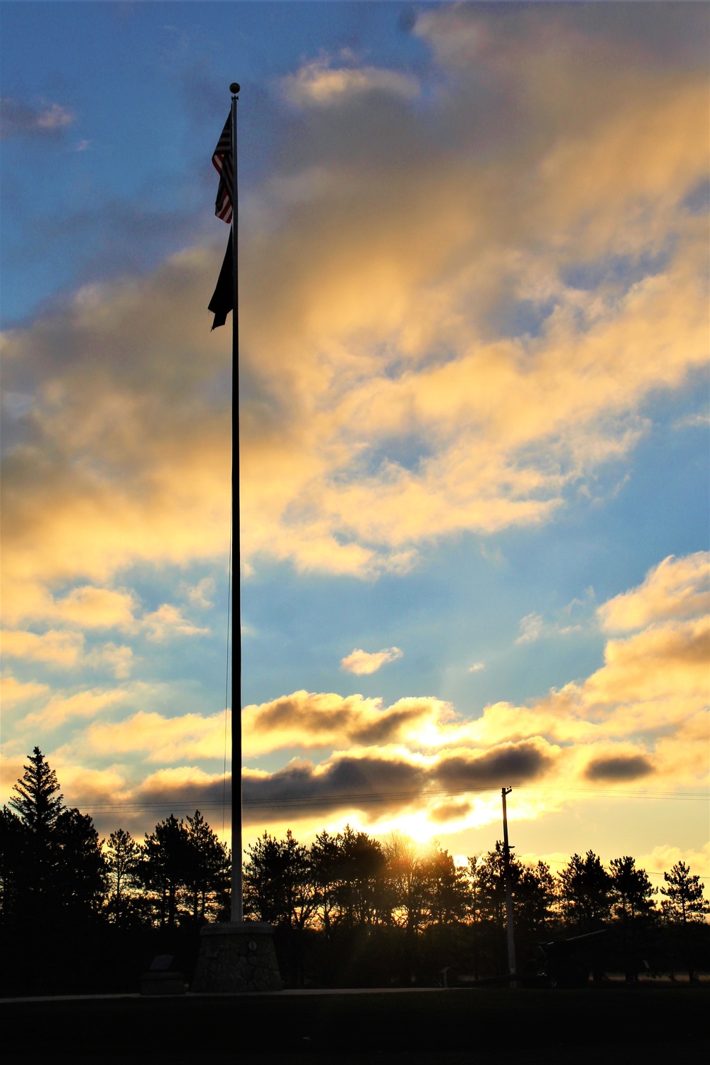 American flag, sunrise, and Veterans Day at Fort McCoy