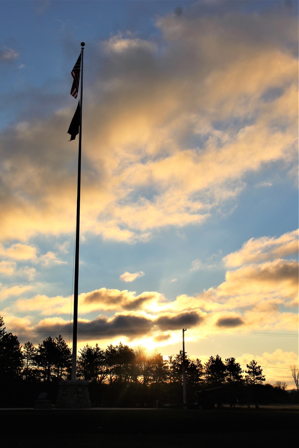 American flag, sunrise, and Veterans Day at Fort McCoy