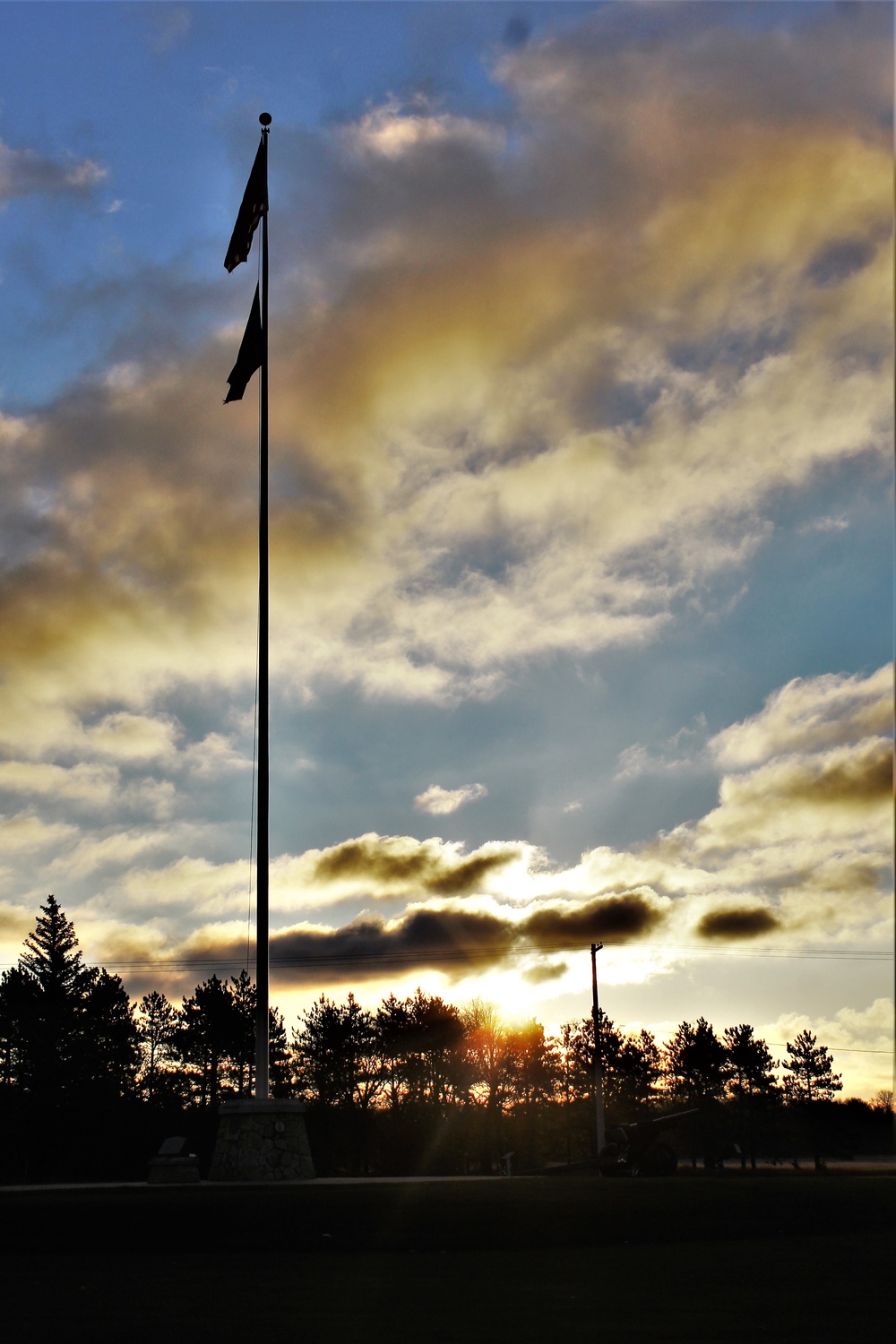 American flag, sunrise, and Veterans Day at Fort McCoy