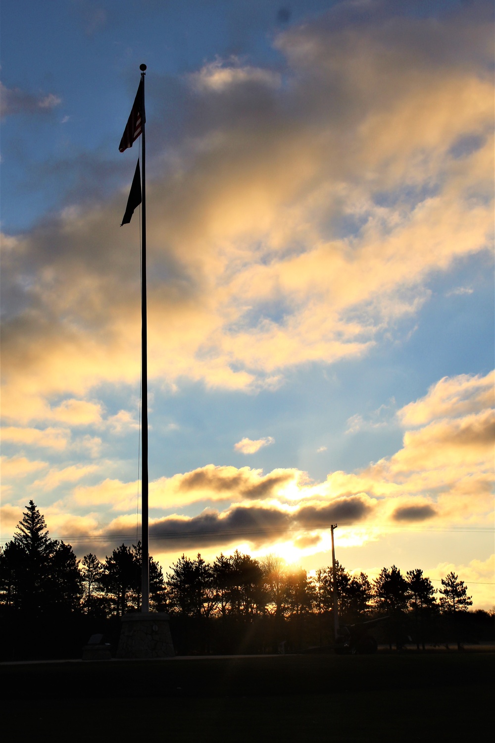 American flag, sunrise, and Veterans Day at Fort McCoy