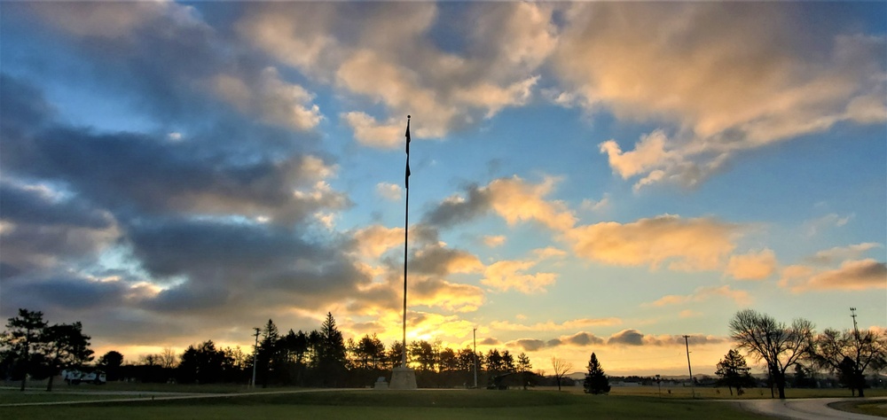 American flag, sunrise, and Veterans Day at Fort McCoy