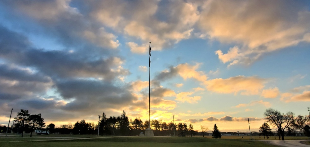 American flag, sunrise, and Veterans Day at Fort McCoy