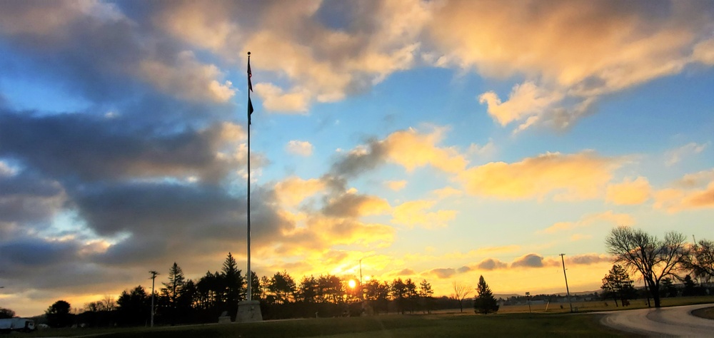 American flag, sunrise, and Veterans Day at Fort McCoy