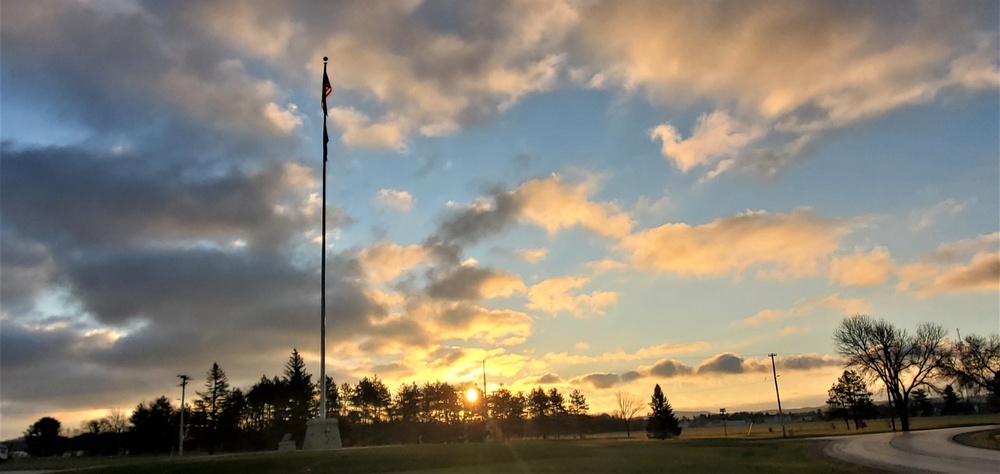 American flag, sunrise, and Veterans Day at Fort McCoy