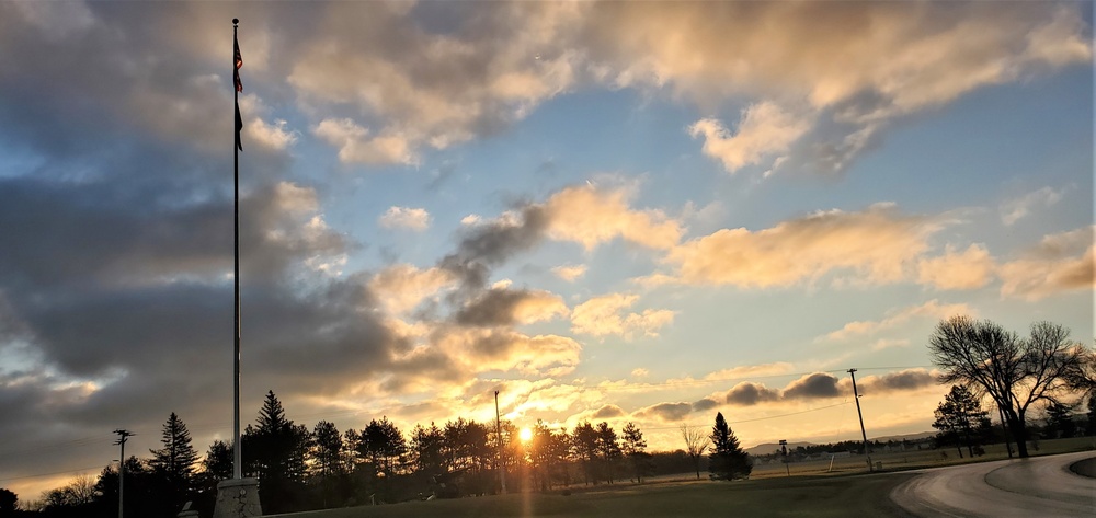 American flag, sunrise, and Veterans Day at Fort McCoy