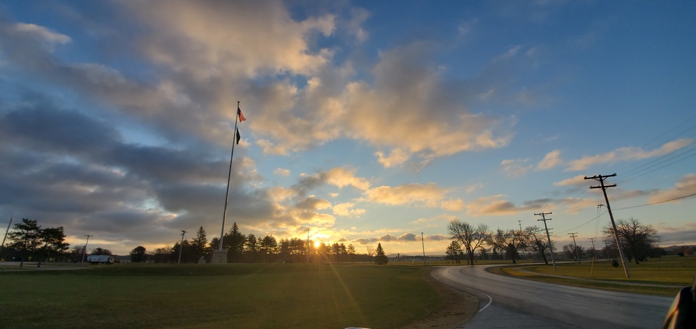 American flag, sunrise, and Veterans Day at Fort McCoy