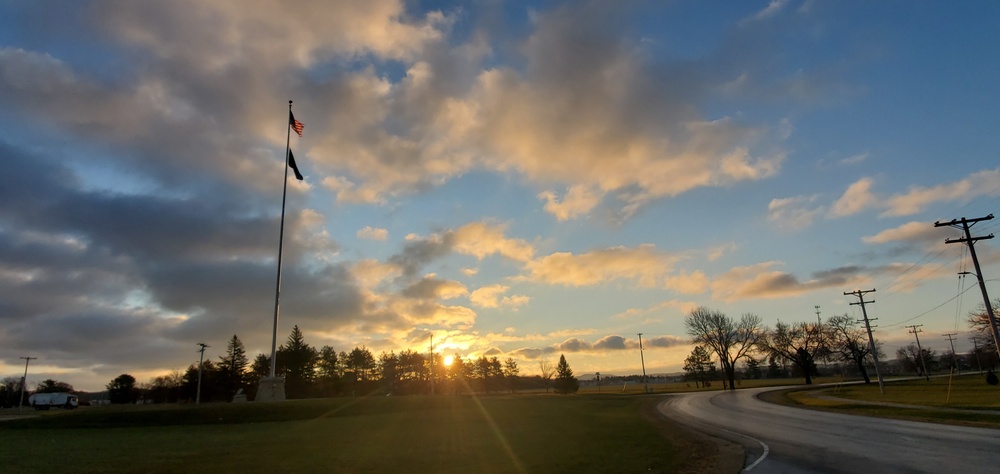 American flag, sunrise, and Veterans Day at Fort McCoy