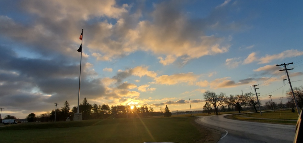 American flag, sunrise, and Veterans Day at Fort McCoy