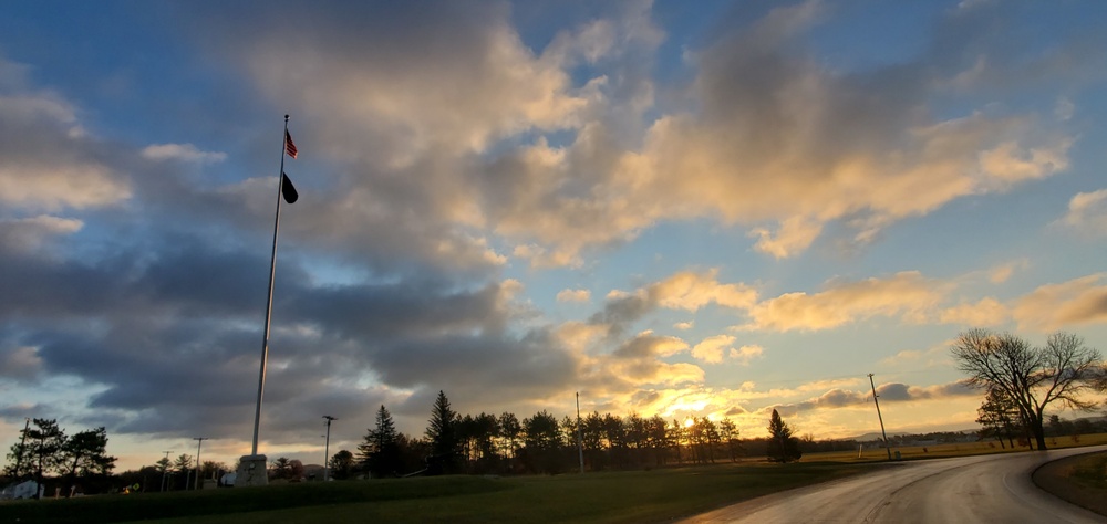 American flag, sunrise, and Veterans Day at Fort McCoy