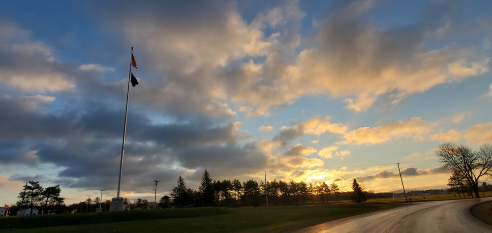 American flag, sunrise, and Veterans Day at Fort McCoy