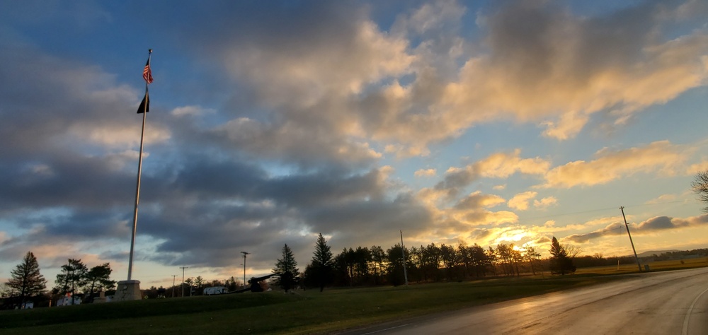 American flag, sunrise, and Veterans Day at Fort McCoy