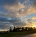 American flag, sunrise, and Veterans Day at Fort McCoy