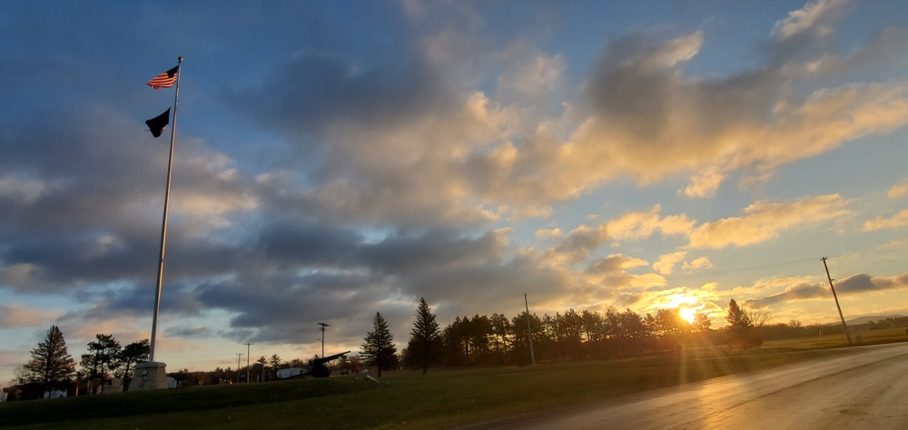 American flag, sunrise, and Veterans Day at Fort McCoy