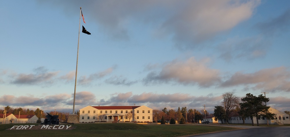 American flag, sunrise, and Veterans Day at Fort McCoy