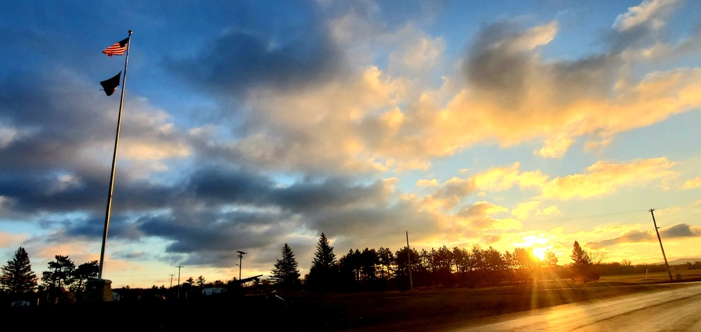 American flag, sunrise, and Veterans Day at Fort McCoy