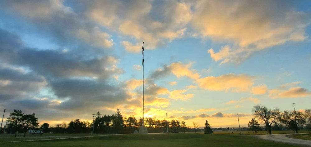 American flag, sunrise, and Veterans Day at Fort McCoy