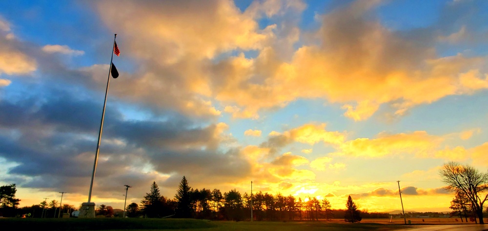 American flag, sunrise, and Veterans Day at Fort McCoy