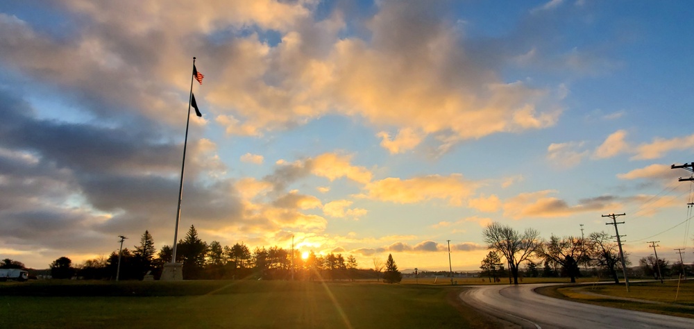 American flag, sunrise, and Veterans Day at Fort McCoy