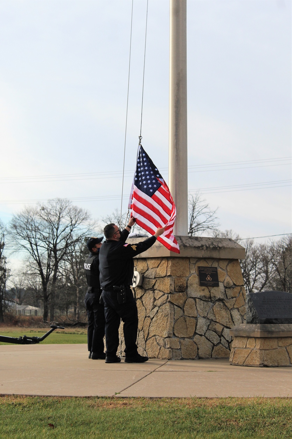 Fort McCoy Police Department officers complete flag raising event